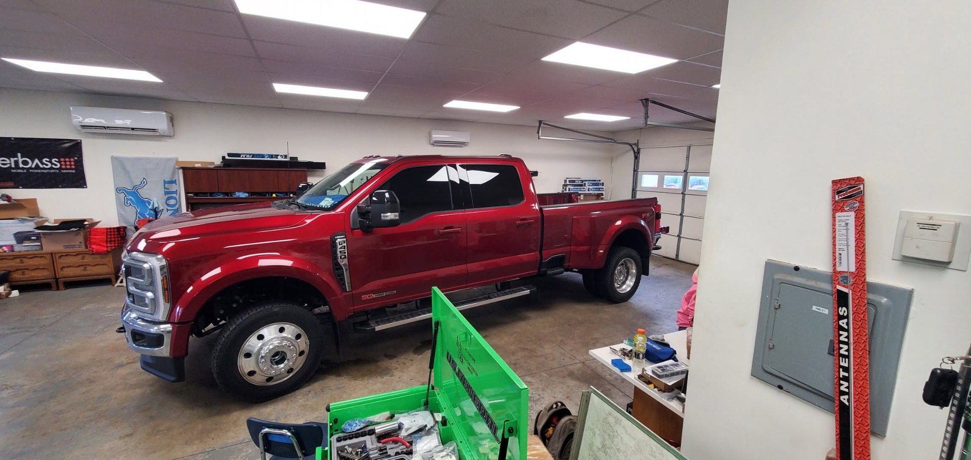 Red Ford F-450 dually in the P.C. Customs shop