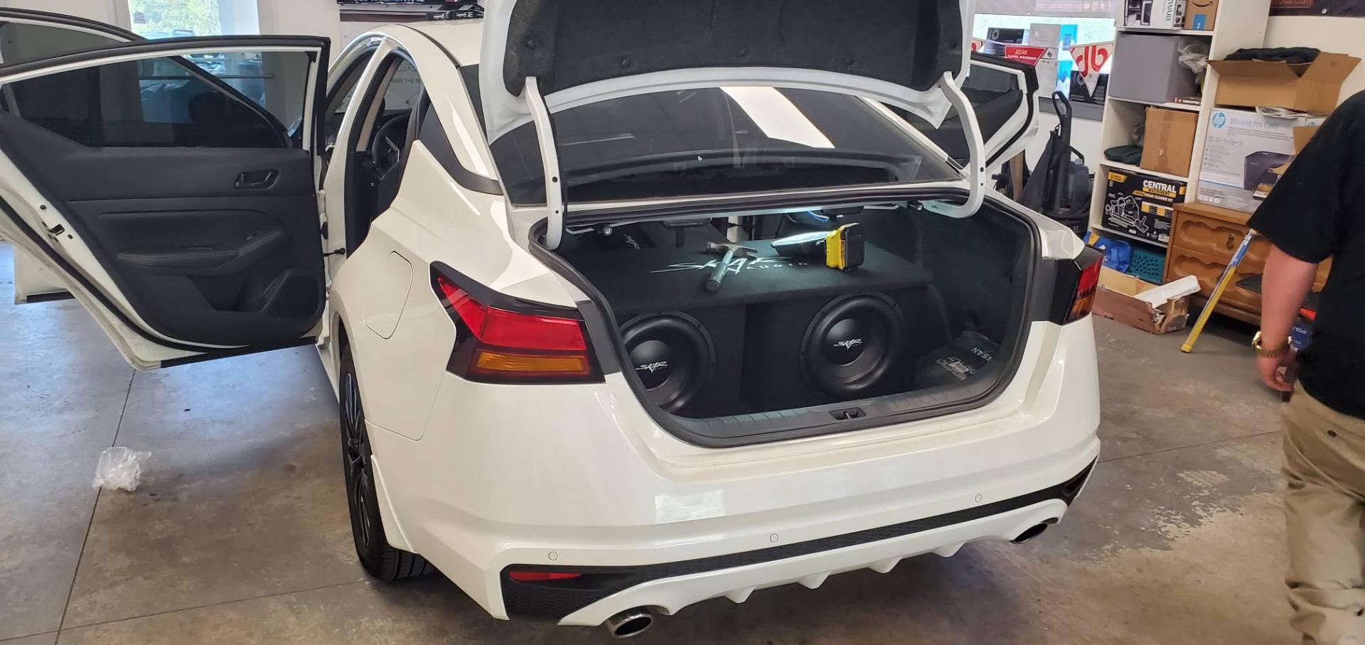 Skar Audio subwoofers installed in Nissan sedan trunk