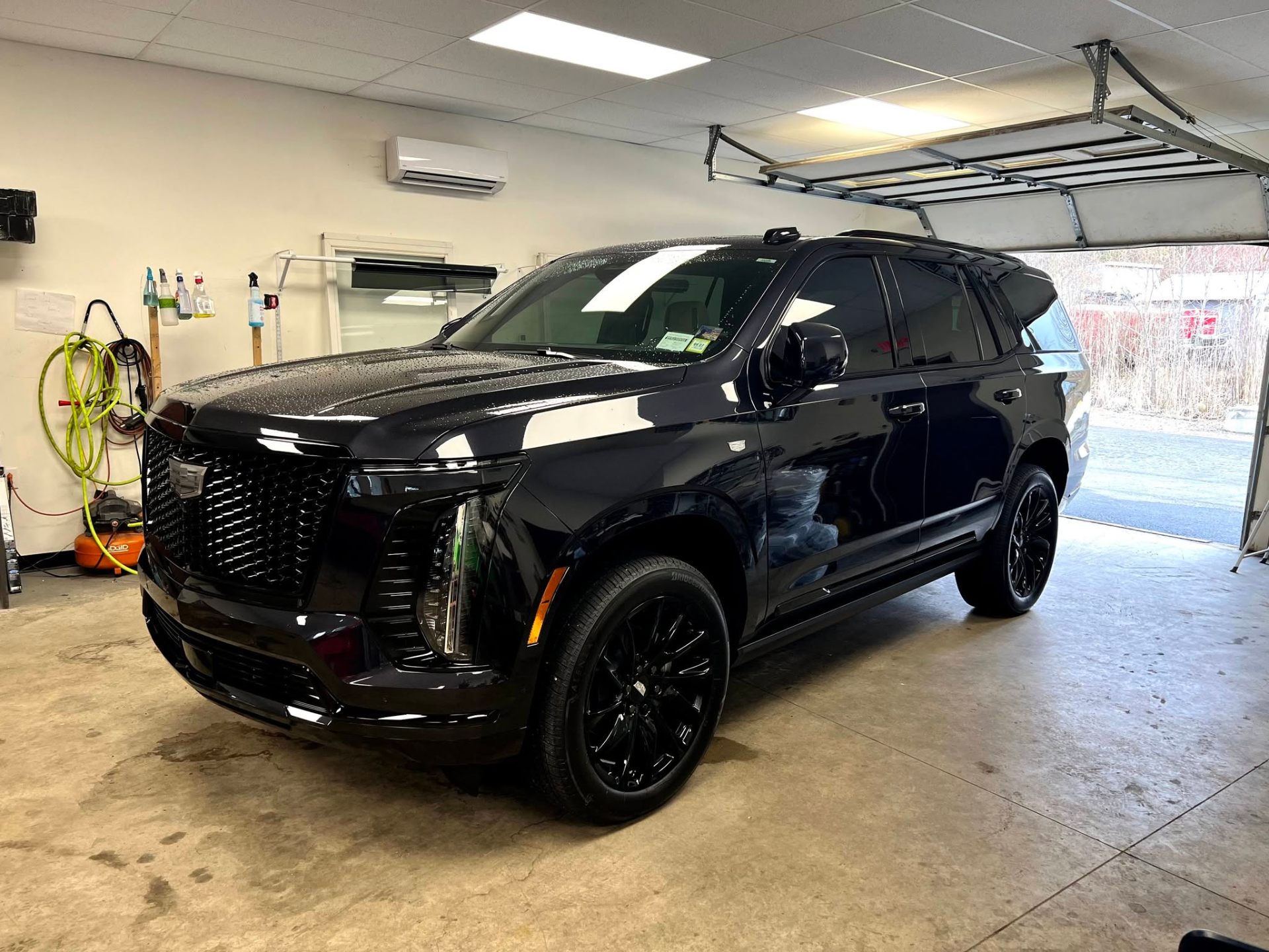 Black Cadillac Escalade window tint job